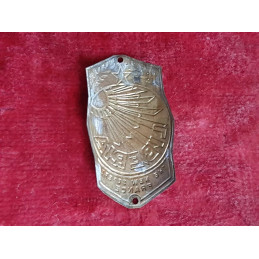 Profile view of the 1950 LIBERIA bicycle frame emblem showing mounting hole curvature