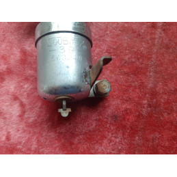 Close-up on the spring-loaded pivoting arm of the vintage dynamo