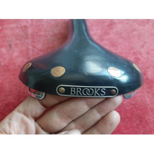 Close-up of copper rivets on vintage Brooks Swift saddle